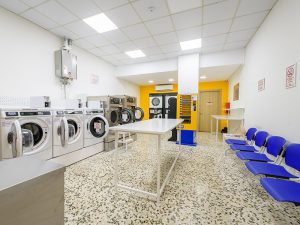 Laundromat Patra Services • Small load (clothes, bed sheets, towels) from 3 € in 30 minutes. • Large load (quilts, blankets, curtains, covers) from 5 € in 30 minutes. • Dryer from 1 €/10' ready in 20' to 40 'minutes depending on the fabrics and quantity. Description The launderette is located in 356 Korinthou, Patra and is open daily from 8am to 11pm every day and Sundays and Holidays, ALL year round. The easywash Self Service Laundry Patra is equipped with commercial washers with coin receiver and commercial dryers with coin receiver by the American company Maytag Commercial. The laundromat also has a soap vending machine and a coin changer. easywash Self Service Laundry are coin laundry stores without personnel. In the self service laundry Patra customers can wash and dry on their own in less than 1 hour. Now washing clothes at easywash Self Service Laundry is fast and cheap.