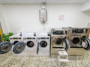 Laundromat Patra Services • Small load (clothes, bed sheets, towels) from 3 € in 30 minutes. • Large load (quilts, blankets, curtains, covers) from 5 € in 30 minutes. • Dryer from 1 €/10' ready in 20' to 40 'minutes depending on the fabrics and quantity. Description The launderette is located in 356 Korinthou, Patra and is open daily from 8am to 11pm every day and Sundays and Holidays, ALL year round. The easywash Self Service Laundry Patra is equipped with commercial washers with coin receiver and commercial dryers with coin receiver by the American company Maytag Commercial. The laundromat also has a soap vending machine and a coin changer. easywash Self Service Laundry are coin laundry stores without personnel. In the self service laundry Patra customers can wash and dry on their own in less than 1 hour. Now washing clothes at easywash Self Service Laundry is fast and cheap.