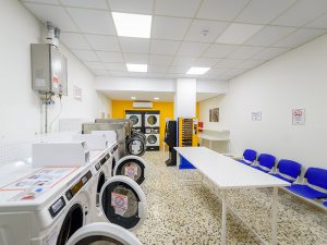 Laundromat Patra Services • Small load (clothes, bed sheets, towels) from 3 € in 30 minutes. • Large load (quilts, blankets, curtains, covers) from 5 € in 30 minutes. • Dryer from 1 €/10' ready in 20' to 40 'minutes depending on the fabrics and quantity. Description The launderette is located in 356 Korinthou, Patra and is open daily from 8am to 11pm every day and Sundays and Holidays, ALL year round. The easywash Self Service Laundry Patra is equipped with commercial washers with coin receiver and commercial dryers with coin receiver by the American company Maytag Commercial. The laundromat also has a soap vending machine and a coin changer. easywash Self Service Laundry are coin laundry stores without personnel. In the self service laundry Patra customers can wash and dry on their own in less than 1 hour. Now washing clothes at easywash Self Service Laundry is fast and cheap.